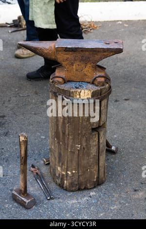 Forging iron on the street. Manufacturing of the knife. Stock Photo