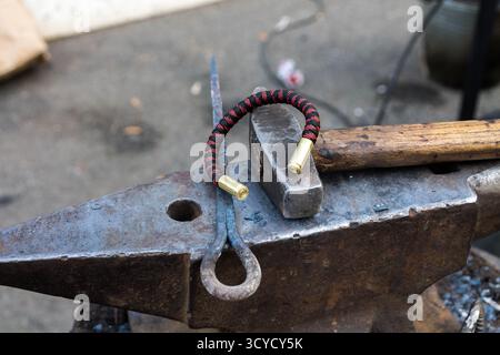Manufacturing of products on the anvil. Tool blacksmith. Stock Photo