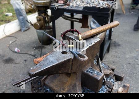 Manufacturing of products on the anvil. Tool blacksmith. Stock Photo