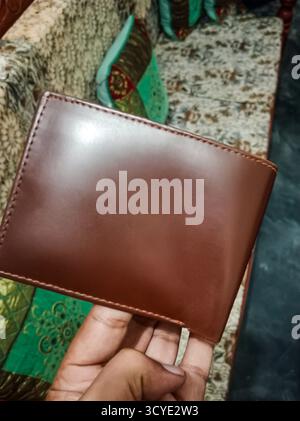 Brown Leather Wallet for men The wallet exudes a sense of sophistication and is perfect for carrying essentials in style Stock Photo