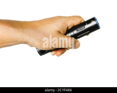 "Hand holding a flashlight" is a gesture using a flashlight to provide light. Typically, it refers to holding the flashlight or a mobile phone that do Stock Photo