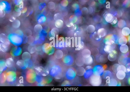 Rainbow bokeh – abstract holiday background with gentle defocused sparkling lights Stock Photo