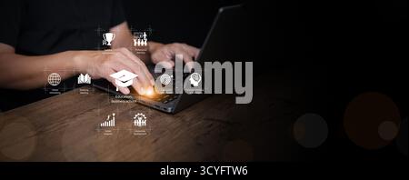 Hands typing on a laptop with virtual education and business icons, symbolizing e-learning, career development, and digital transformation in professi Stock Photo