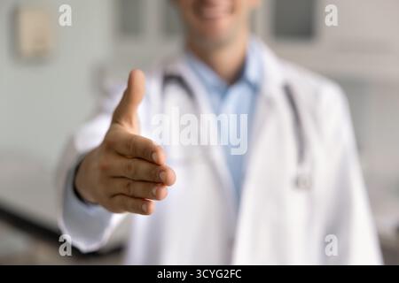 Close up of male doctor outstretched his hand for handshake Stock Photo