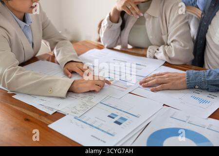 Closeup tax consultant review financial papers on meeting with clients Stock Photo