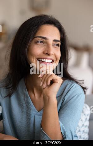 Happy beautiful young Hispanic woman posing for candid vertical portrait Stock Photo