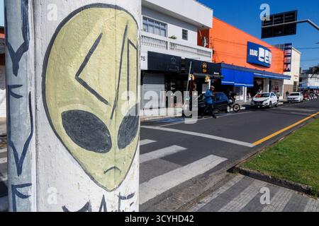 Alien encounter artwork on lamppost, Peruibe, Brazil Stock Photo