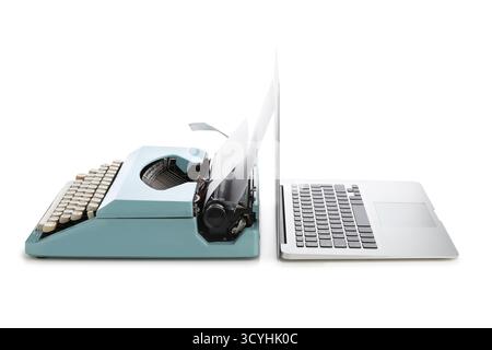 Vintage typewriter and modern laptop isolated on white background, closeup Stock Photo