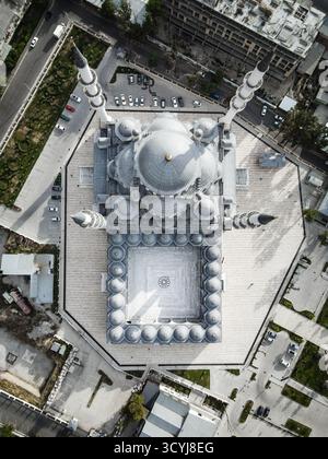 A direct top-down aerial view above a semi-truck, tractor trailer being ...