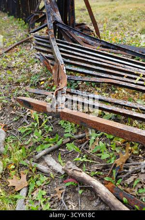 Fallen and rusted metal fence Stock Photo