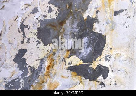 Corroded wall surface with rust and peeling paint. Stock Photo