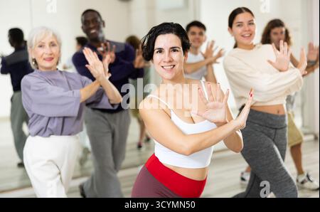Group of people practicing energetic lindy hop movements Stock Photo