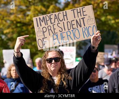 A man holds a sign as he marches in a No Kings demonstration in Eugene, Oregon, on October 18, 2025. Stock Photo