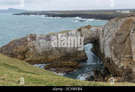 The White Arch (Bwa Gwyn) sea arch from the coastal path near Rhoscolyn, Anglesey, North Wales, UK. Taken on 2nd October 2025. Stock Photo