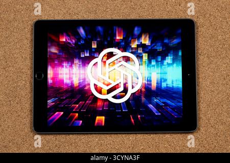 Close up to a digital tablet with the chat GPT software loge over a hardware concept and a cork background Stock Photo