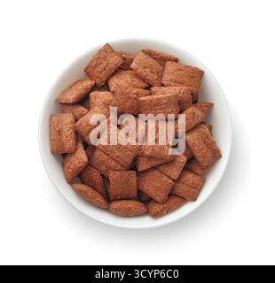 Top view of chocolate cereal pillows in ceramic bowl isolated on white Stock Photo