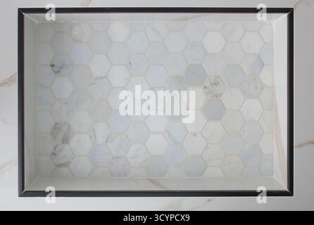 A view of a white marble hexagon tile surface, as a background. Stock Photo