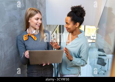 Happy software developers working on meeting, Programming advanced code artificial intelligence. Stock Photo