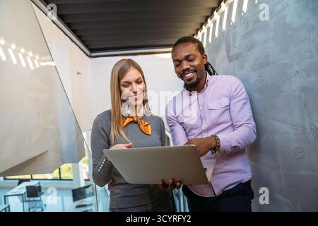 Artificial intelligence and technology development team using laptops, coding and smart solutions Stock Photo