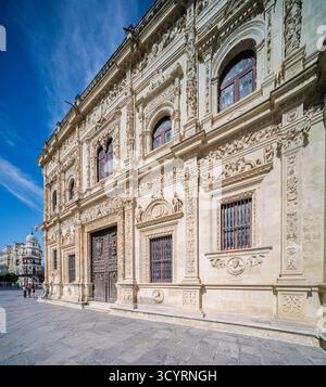 Intricate Renaissance reliefs adorn the Plateresque façade of Seville's City Hall, facing Avenida de la Constitución with La Adriática's dome in view. Stock Photo