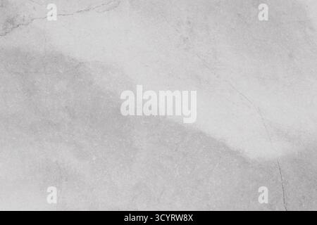 Textured gray marble background features soft gradients and subtle veining, providing ample copy space for design projects, ideal for elegant presenta Stock Photo