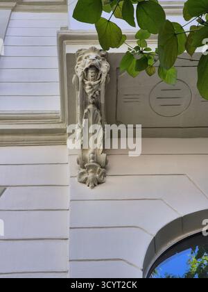 architectural detail on a house in the form of a stone lion Stock Photo
