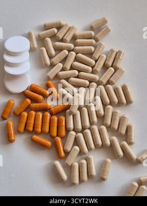 Pills and vitamins on a white background. Stock Photo