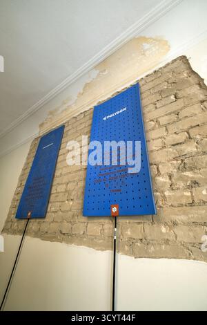 17.06.2025, Germany, Bremen, Bremen - Heating mats on the interior wall of an old building for drying after water damage caused by a neighbour. 00A250 Stock Photo