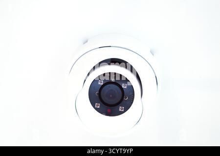CCTV camera on the hull of an expensive motor yacht. CCTV camera white on a white body Stock Photo