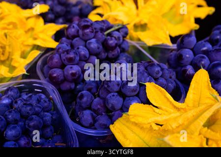 Uva Fragola Strawberry Grape in Little Cups at the Market in Italy Stock Photo