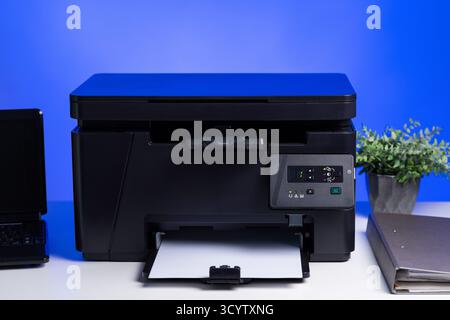 The multi-function laser printer in the home office. Stock Photo