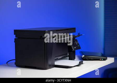 The multi-function laser printer in the home office. Stock Photo