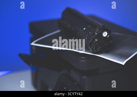 Black cartridge for laser printer. Laser printer issues concept. Stock Photo