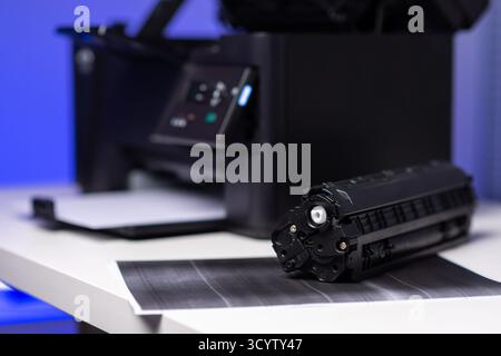 Black cartridge for laser printer. Laser printer issues concept. Stock Photo