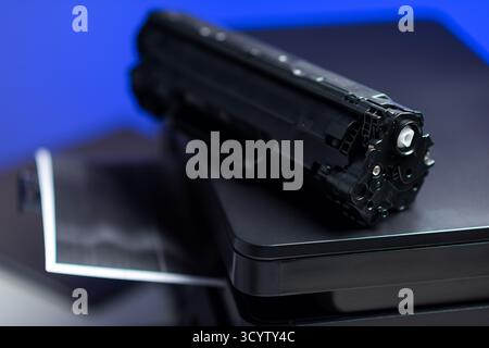 Black cartridge for laser printer. Laser printer issues concept. Stock Photo