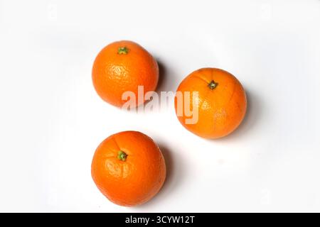 Fresh Three Oranges Isolated on White Background. Stock Photo