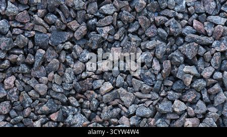 A background of crushed granite. Close up. Stock Photo