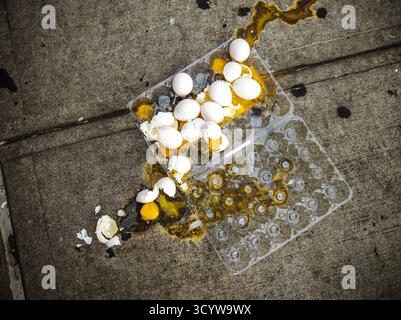 A package of two dozen broken eggs on the sidewalk in New York on Thursday, October 2, 2025. (© Richard B. Levine) Stock Photo
