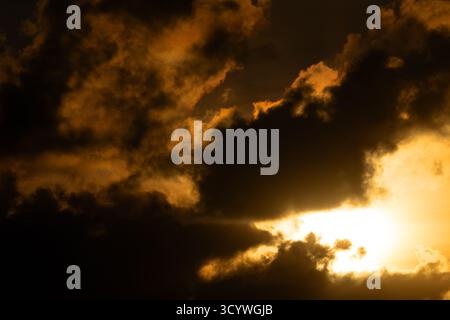 Dramatic Sunset with Dark Clouds Over Newfoundland Landscape Stock Photo
