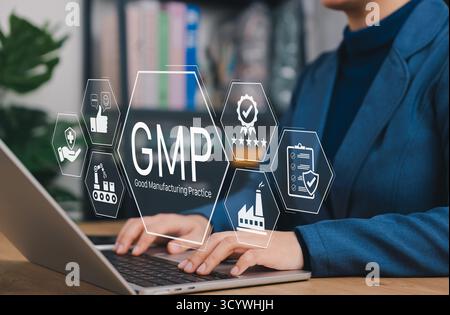 GMP concept. Good Manufacturing Practice, Businesswoman using laptop and icons of quality control, standards, production, checklist, safety Stock Photo