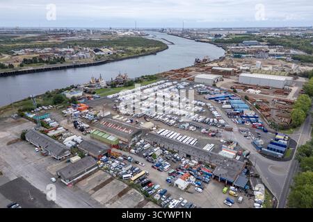 Aerial view looking north east from close to the Riverside stadium along the River Tees towards the North Sea, Stockton-On-Tees, North Yorkshire, UK. Stock Photo