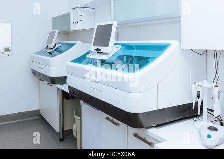 Laboratory features two high-tech machines designed for precise analysis and testing in a clean, organized environment. Stock Photo