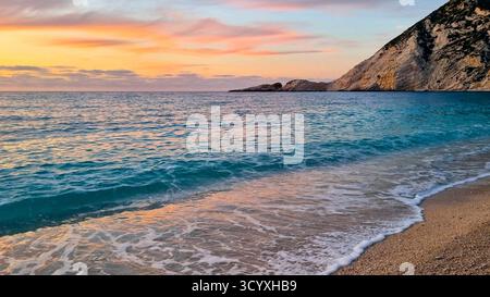 Colorful sunset on the picturesque Petani beach on the Ionian island of Kefalonia, Greece Stock Photo