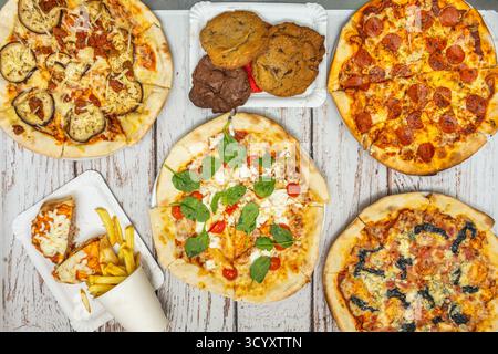 Spinach and ricotta pizza with fresh spinach, creamy ricotta, flaked garlic, and nutmeg Stock Photo