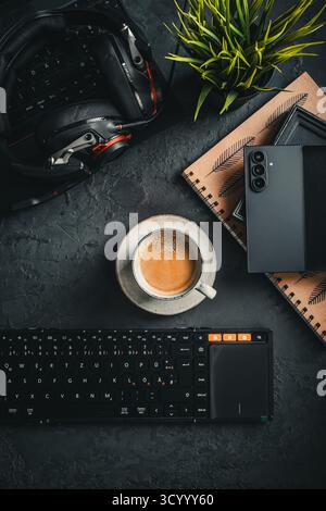 Office desk table with laptop computer, cup of coffee and supplies. Stock Photo