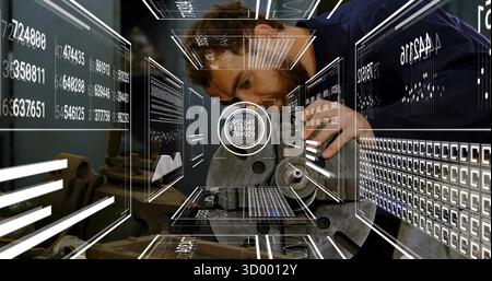 Leaning technician in work shirt examining metal component with probe in workshop with AR overlays Stock Photo