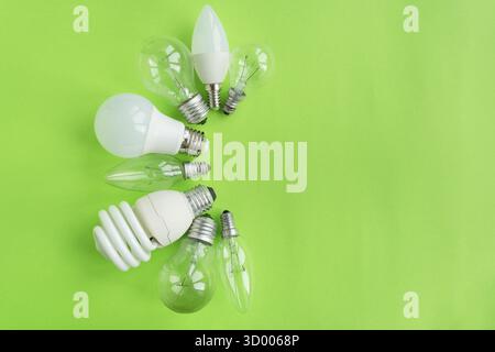 A set of different types of LED lamps isolated on a green background. Energy-saving lamps Stock Photo