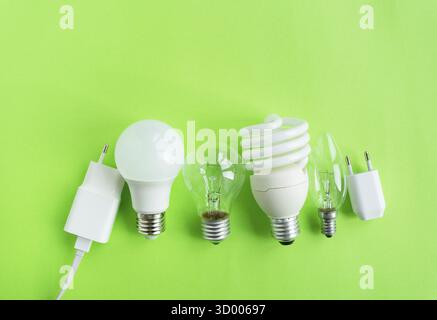 A set of different types of LED lamps isolated on a green background. Energy-saving lamps Stock Photo