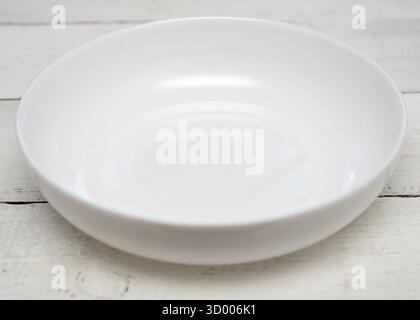 White empty plate on a wooden table Stock Photo