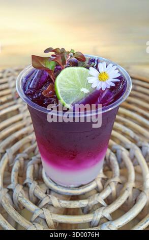 Sweet and Tangy Iced Butterfly Pea Flower Tea with Fresh Lime Juice Stock Photo